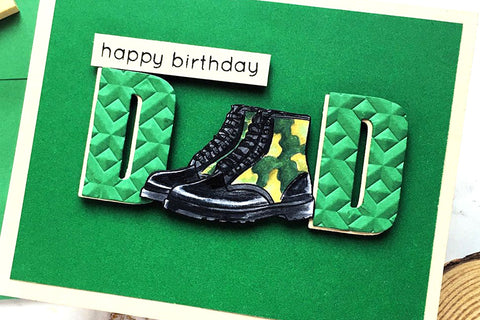 A birthday greeting card for Dad on a green background, with the 'A' in "DAD" replaced with a pair of military boots