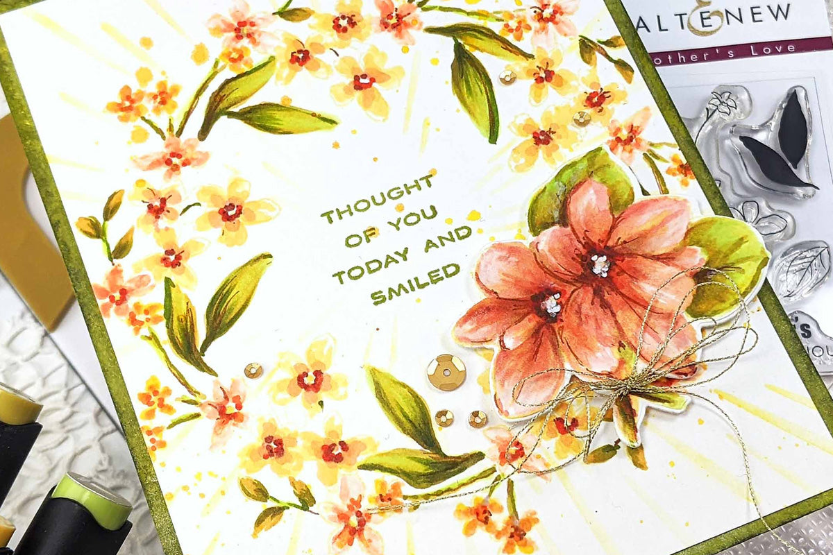 A beautiful floral card with a wreath design and green borders, along with the sentiment "Thought of you today and smiled"