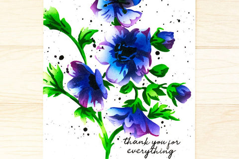 A beautiful card of blue-and-purple bloom on a white cardstock panel with the sentiment "Thank you for everything"