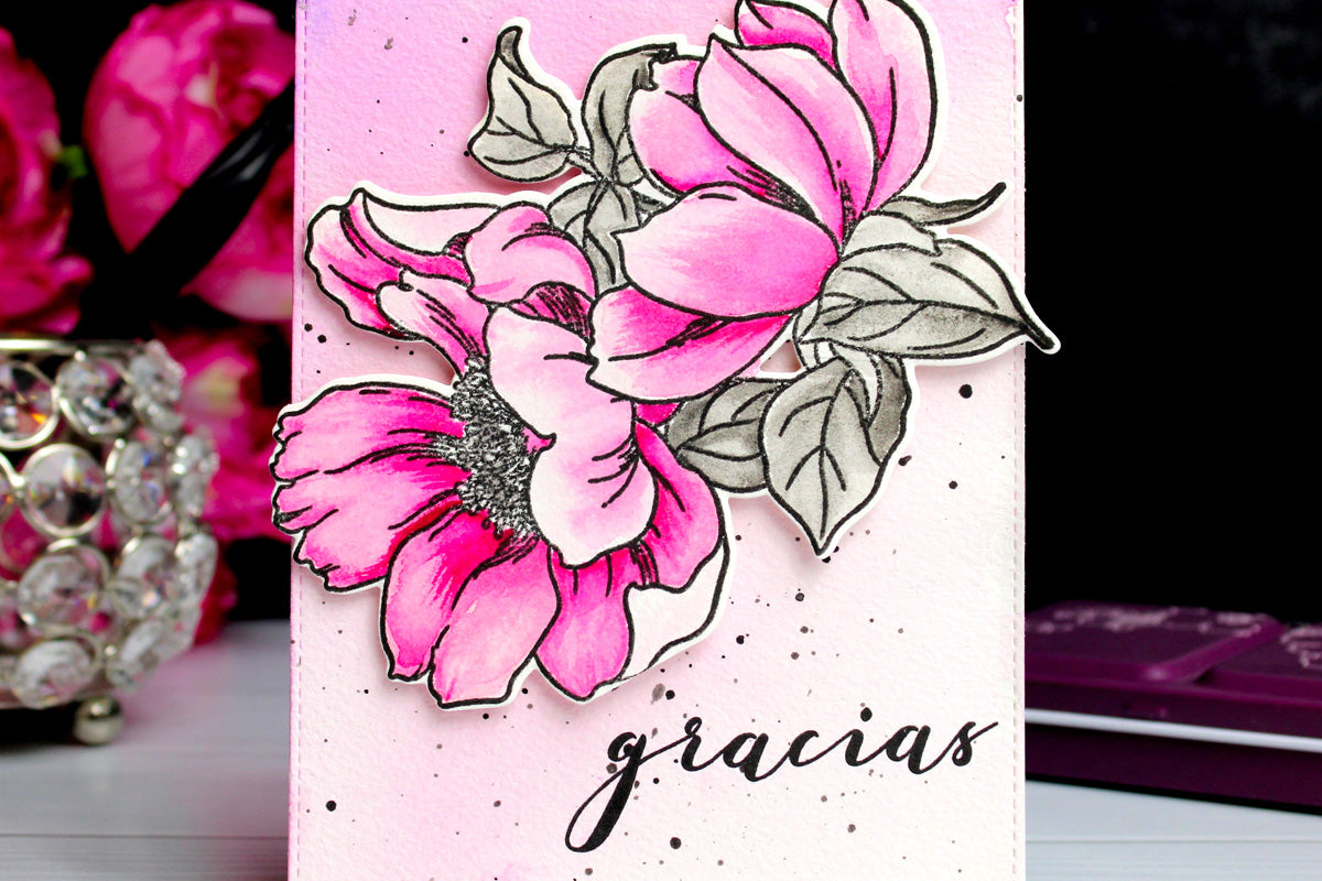 A thank-you card with the Spanish word "gracias", designed with beautiful pink blooms on a pink-stained white cardstock panel