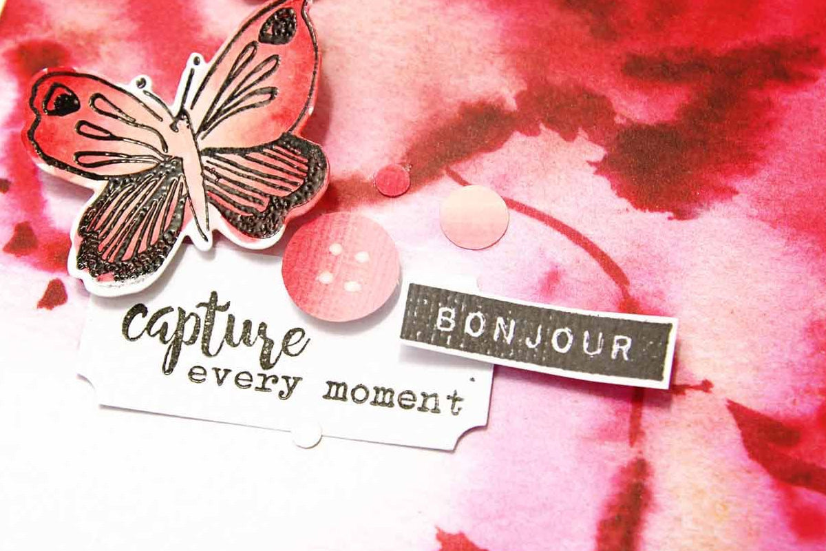 A close-up of DIY embellishments on a scrapbook page