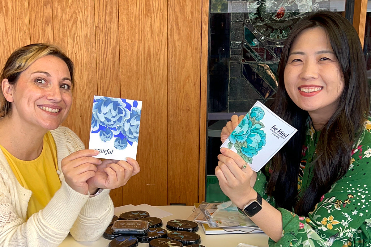 Altenew's May Park and Lydia Evans crafting together and making cards with the same products and inks