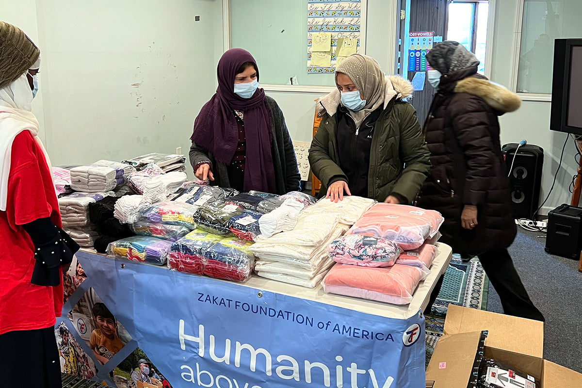 Altenew's President Tasnim Ahmed with a few Altenew staff donating blankets and jackets to the Zakat Foundation during winter in New York