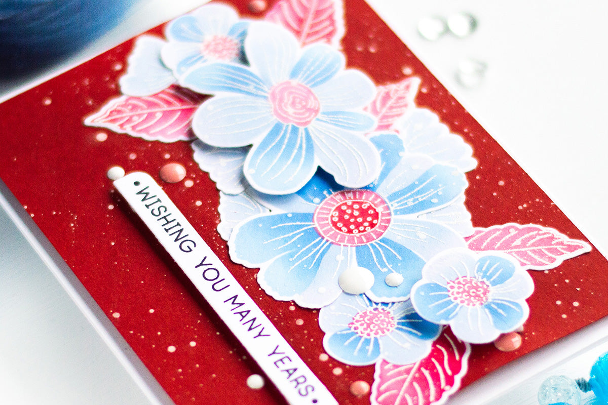 Bold and colorful birthday card idea with blue flowers and a red background