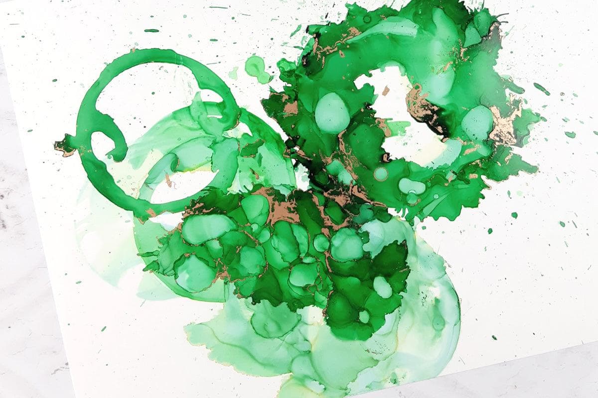 Play with alcohol ink techniques for beginners using this stunning green alcohol ink!