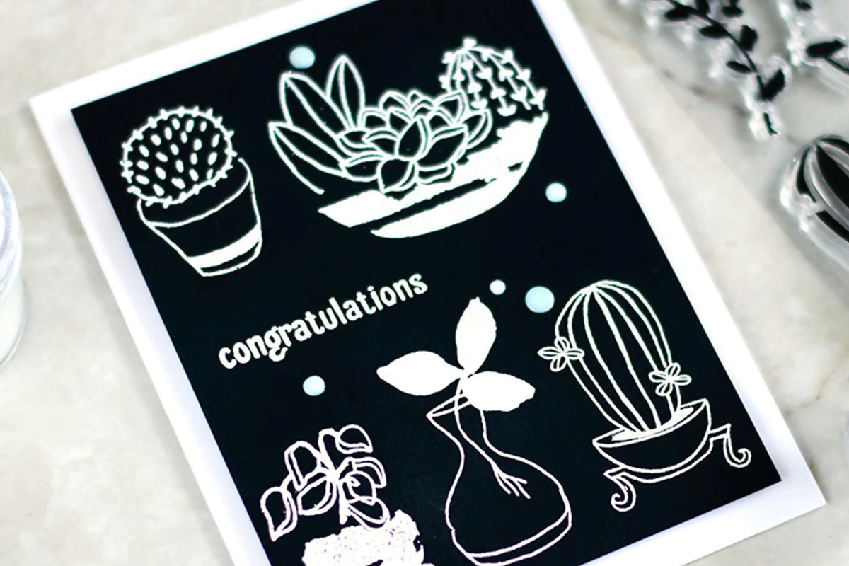 A card featuring white embossing on black cardstock makes for the perfect heat embossing project idea!
