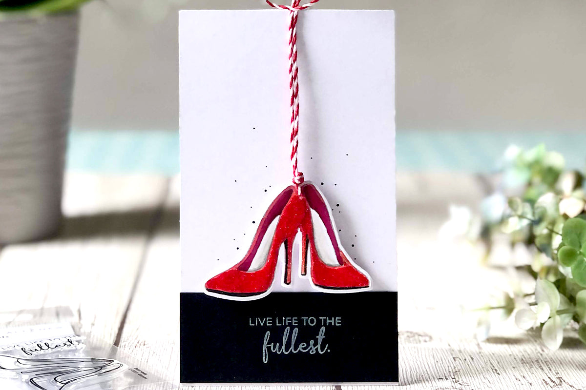 Cute interactive card with red stiletto heels and a string
