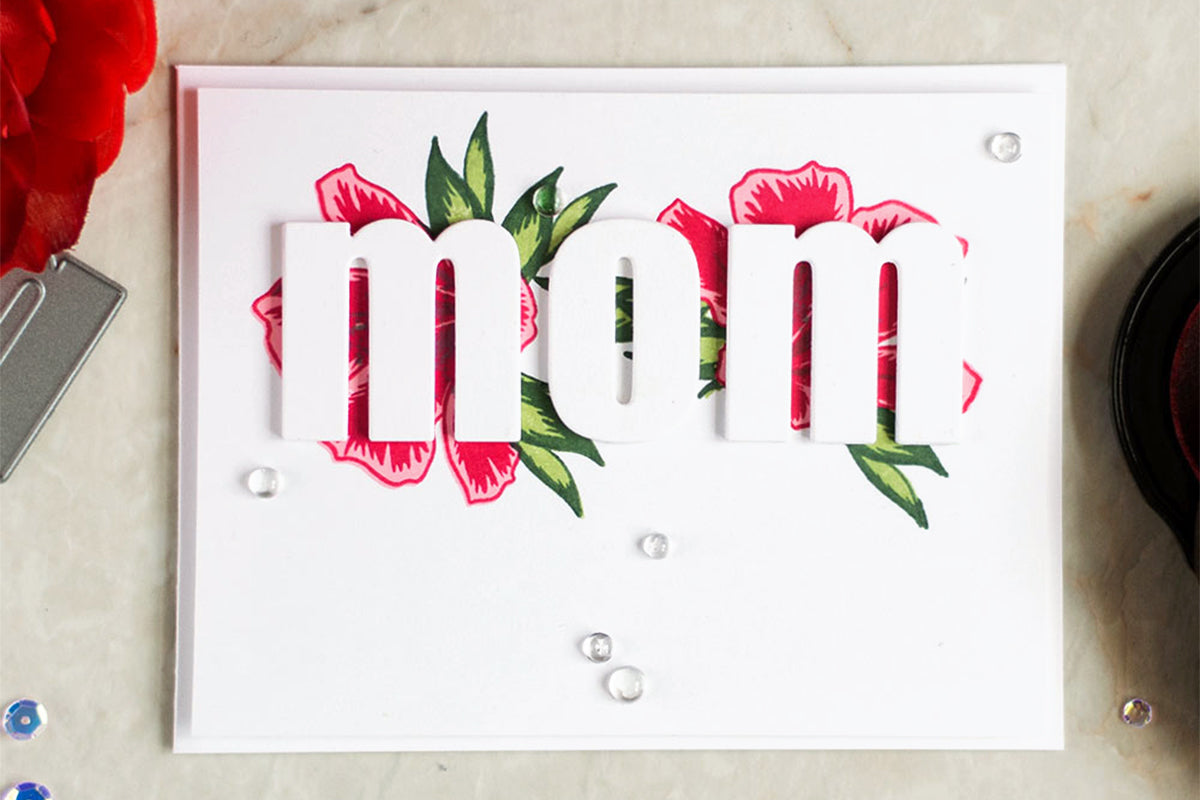 Simple and easy Mother's Day Card idea with the word "mom" and 2 stamped flower images