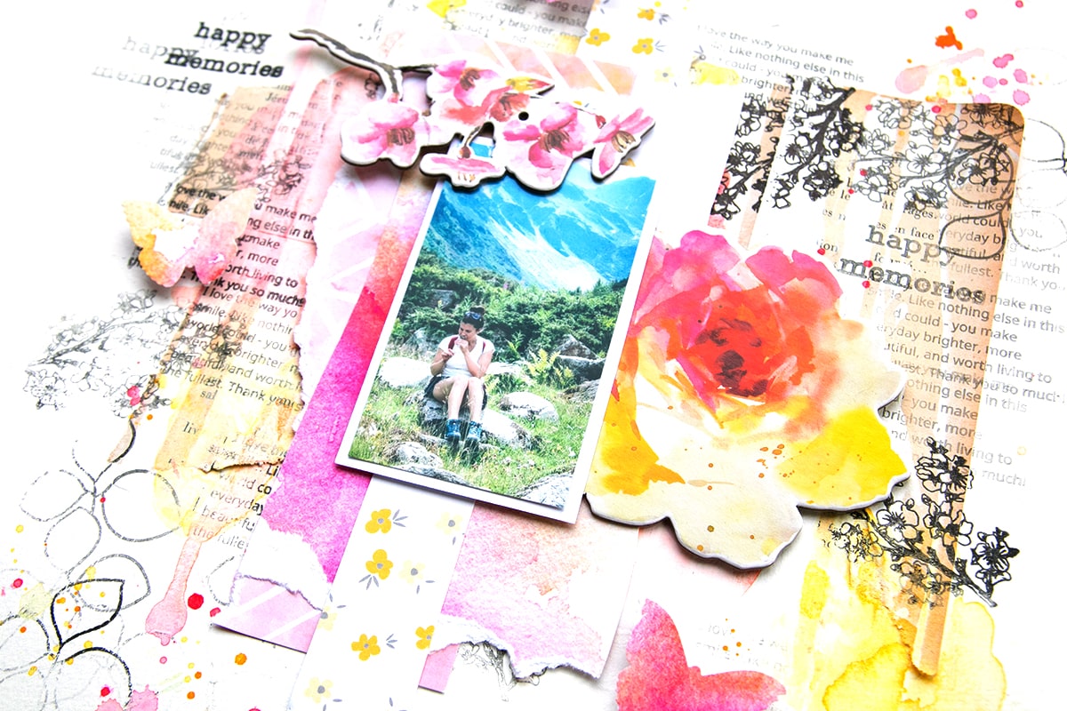 Mixed media scrapbooking layout using stencil and ink sprays