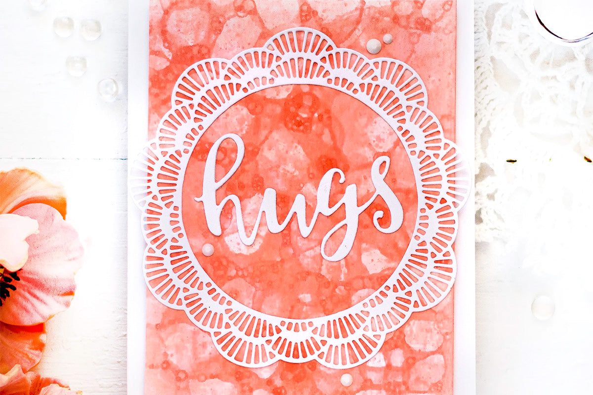 Handmade card with soapy bubble background and lace design