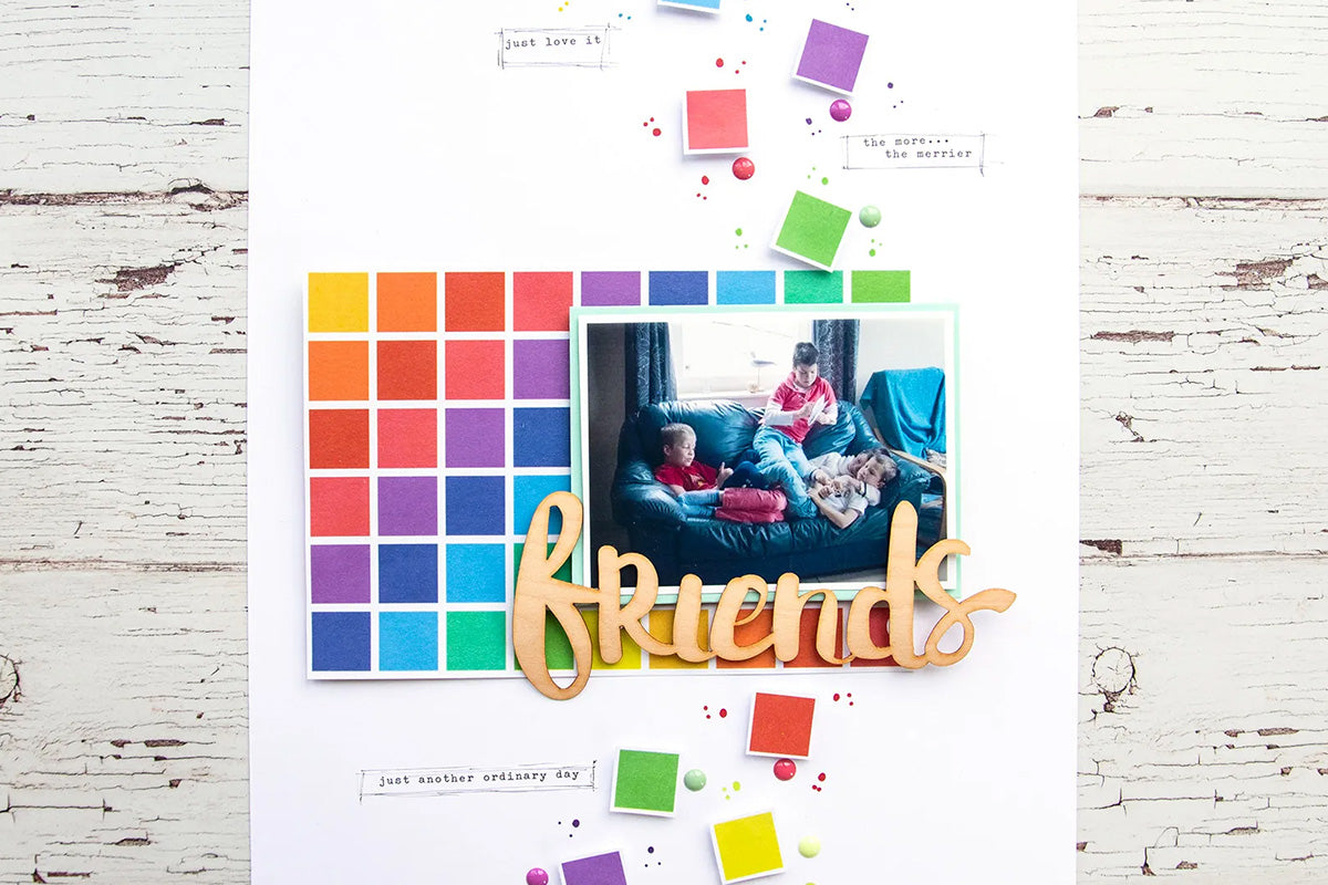 Colorful friendship scrapbook layout with rainbow washi tape
