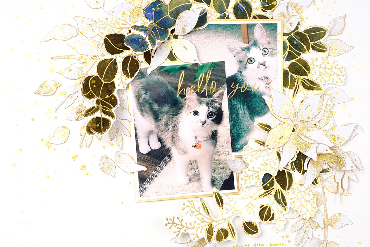 Cat themed scrapbook idea with a gold foiled leafy wreath design
