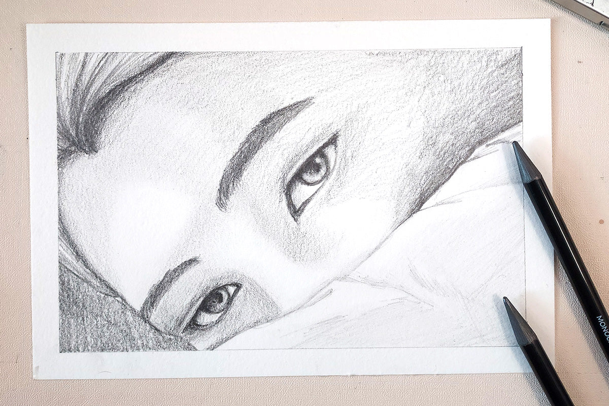A portrait sketch of a woman's face with the lower half covered, sketched using Artistry's Monochrome Shading Pencils