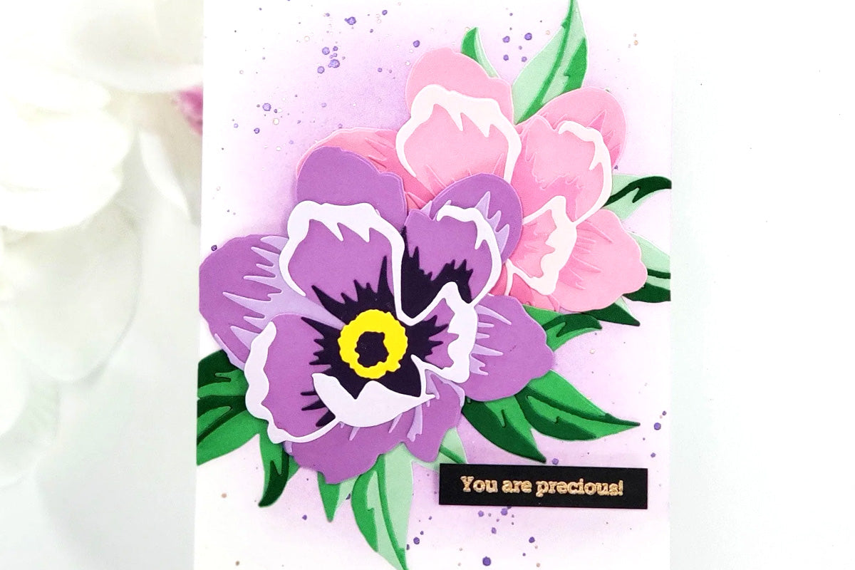 A "you are precious" greeting card with die-cut purple and pink orchid blooms as the focal points