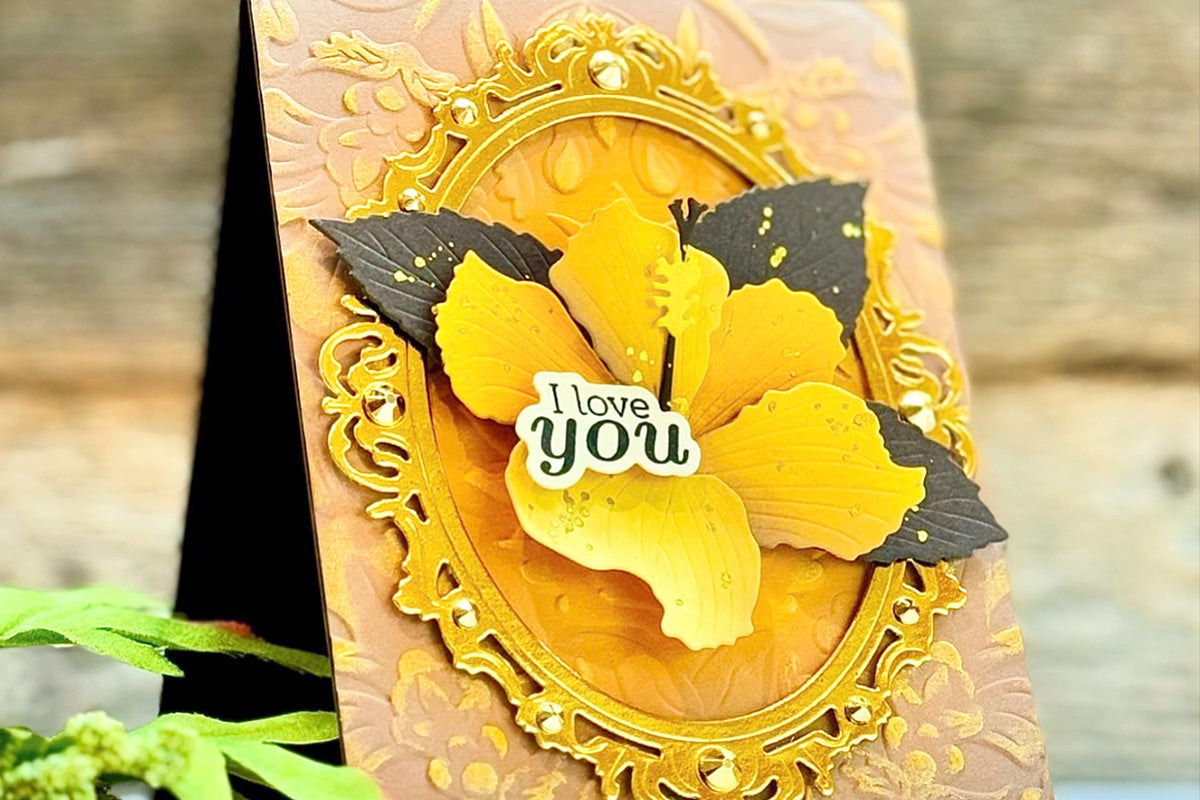 A love greeting card with a lovely yellow background and a yellow hibiscus flower as a focal point, created with designed with the Sparkled Frame Die
