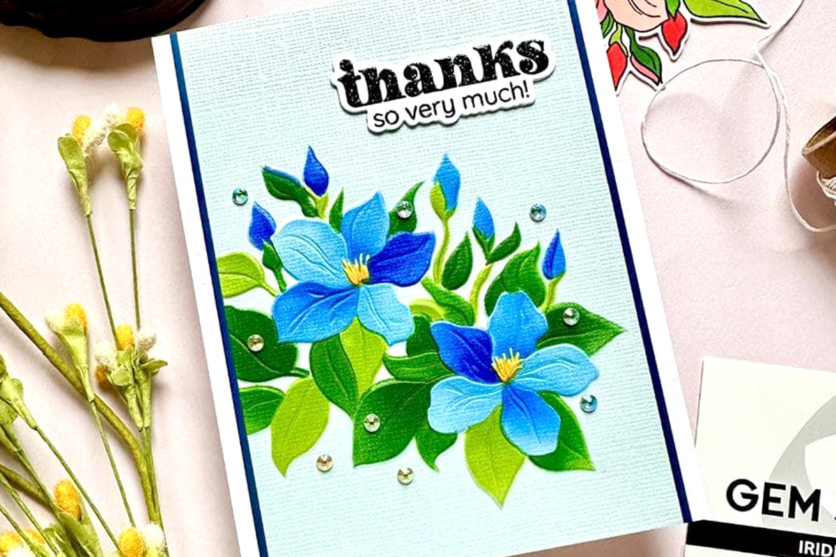 A thank-you card with blue motif, embellished with Iridescent Crystals Gem Sparkles