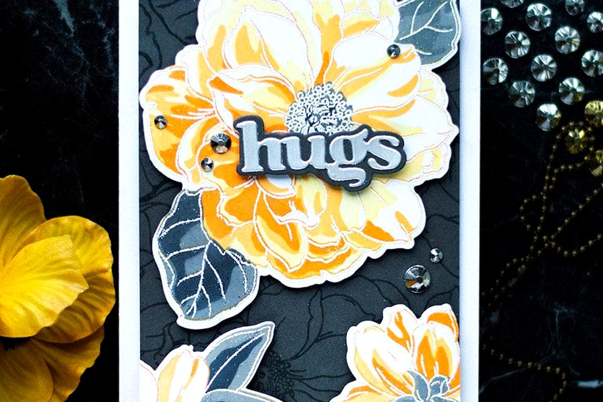A hugs card embellished with Metallic Gold and Silver Gem Sparkles