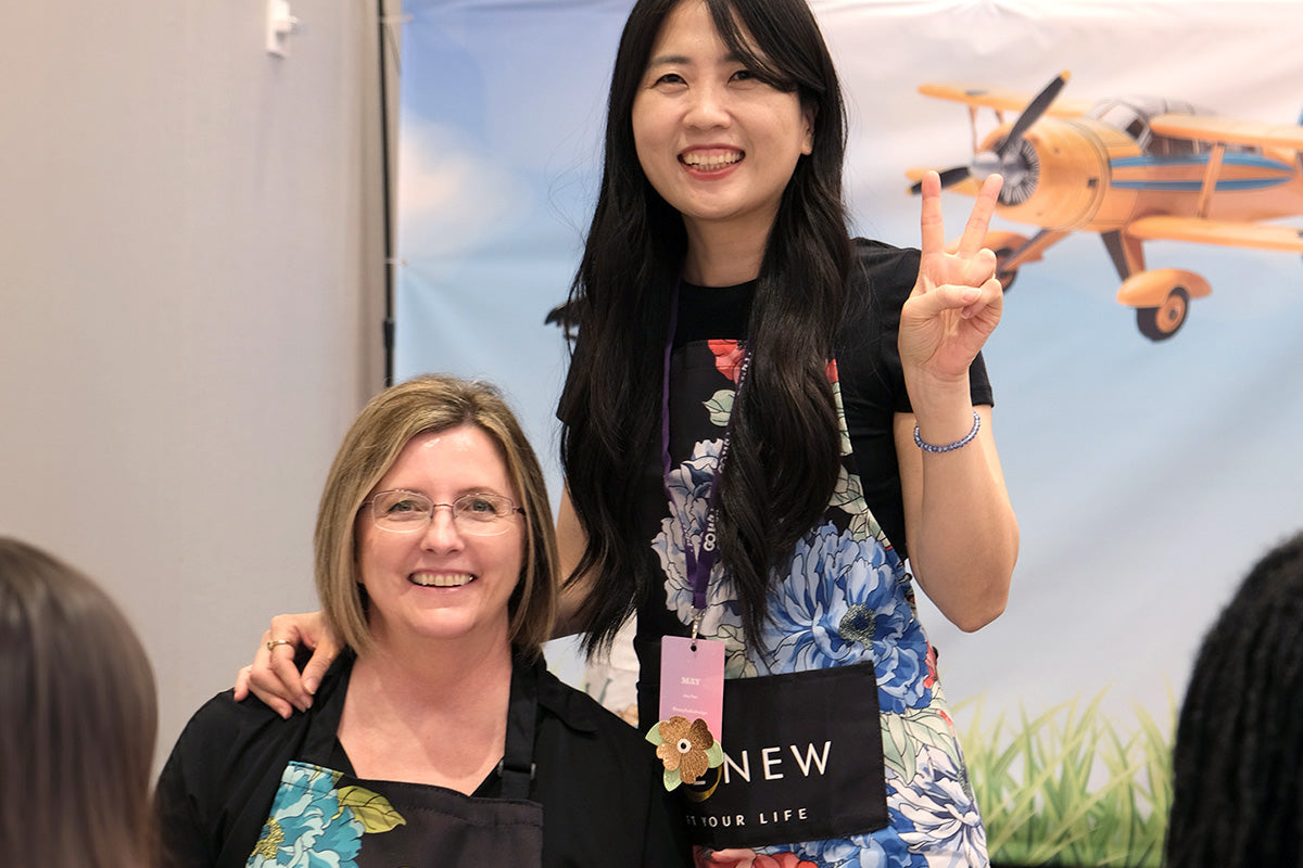 Altenew's May Park and AECP Educator April Leithner wearing black crafting aprons from Altenew