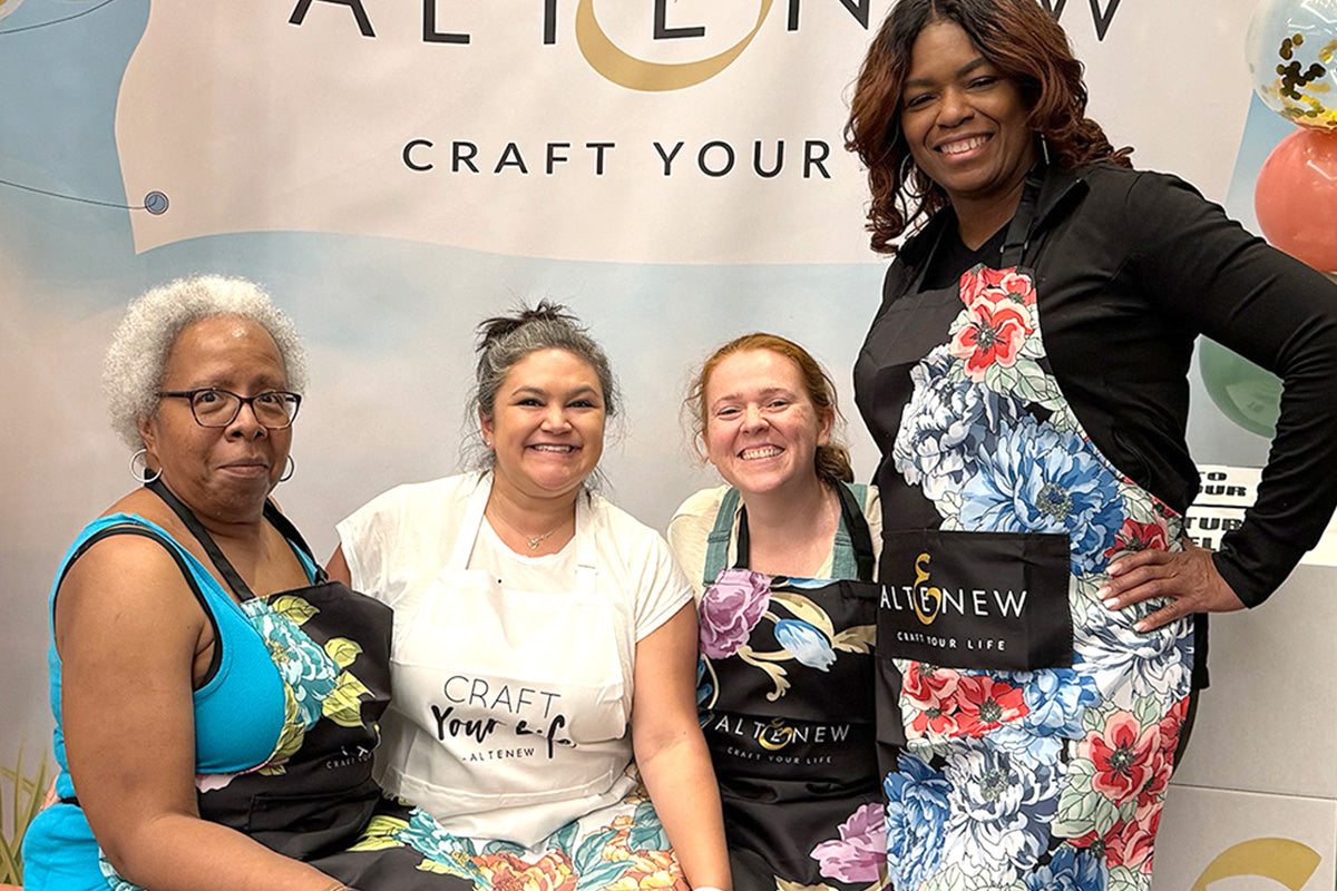 4 beautiful crafters showing off their Altenew Artsy Aprons at the Go Wild Planner Conference 2024