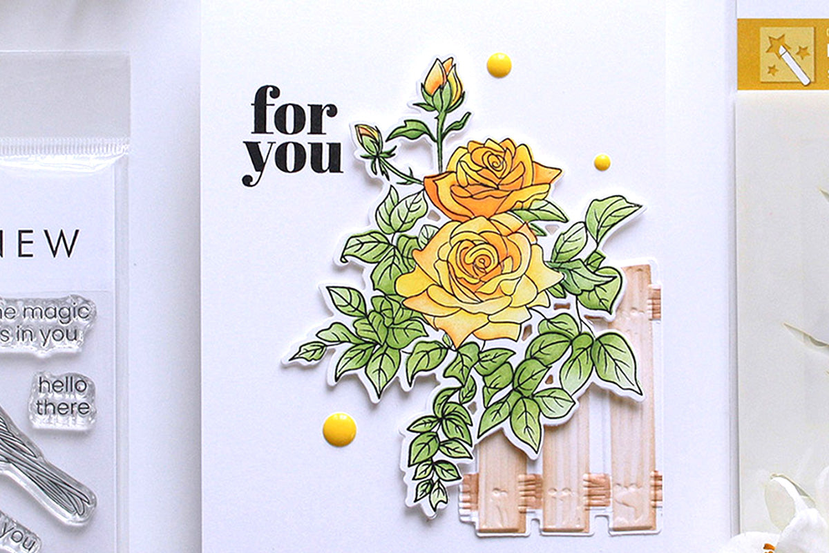 Clean and simple DIY greeting card with a small wooden fence and a yellow rose bush