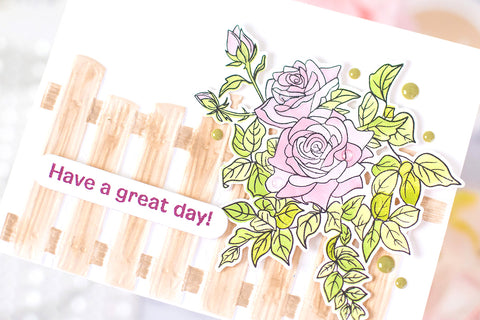 Handmade greeting card with a 3D embossed wooden fence and a bush of pink roses