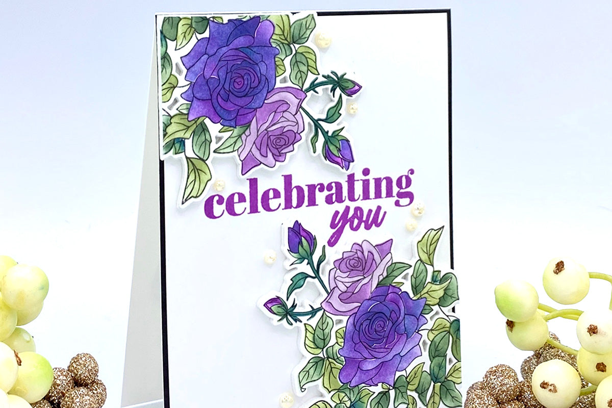 Celebratory greeting card with purple rose bushes and the sentiment "Celebrate You"