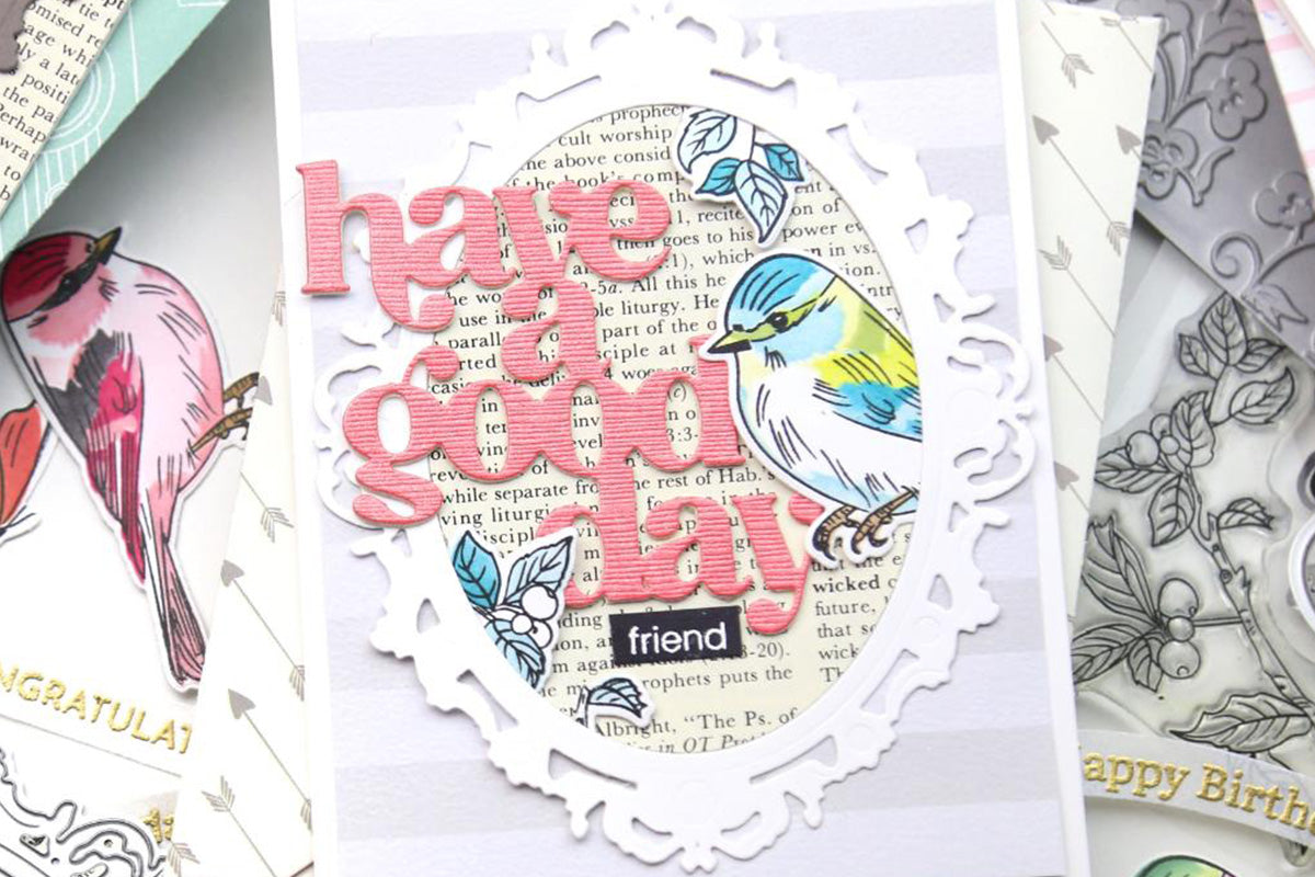 Friendship themed card with the sentiment "have a good day friend" and a bird die-cut inside an ornate mirror frame die-cut