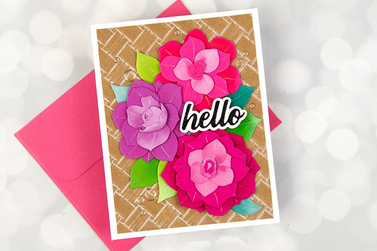 Handmade greeting card with 3 floral die-cuts and a matching pink greeting card envelope