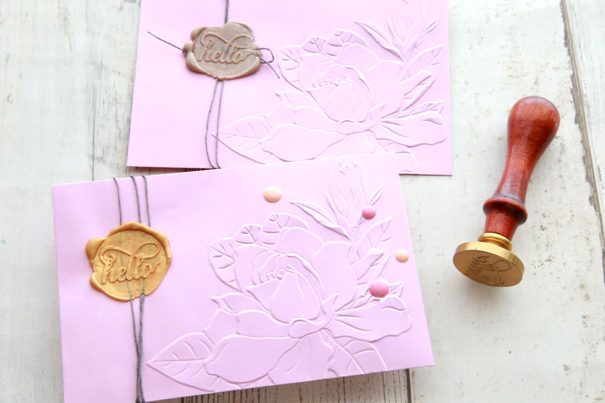 two lavender envelopes for card making, with a 3D embossed flower image and wax seal