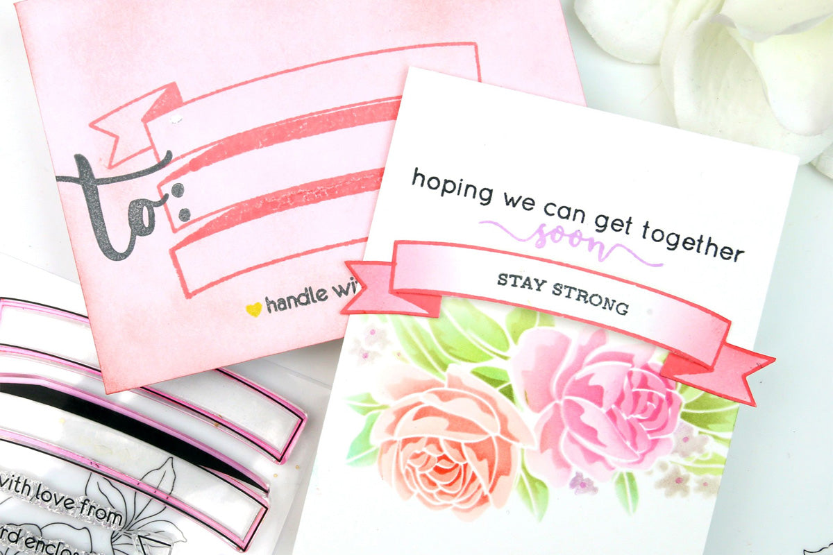 A floral handmade card with a motivational message and a matching colored envelope, decorated with Altenew stamps and dies