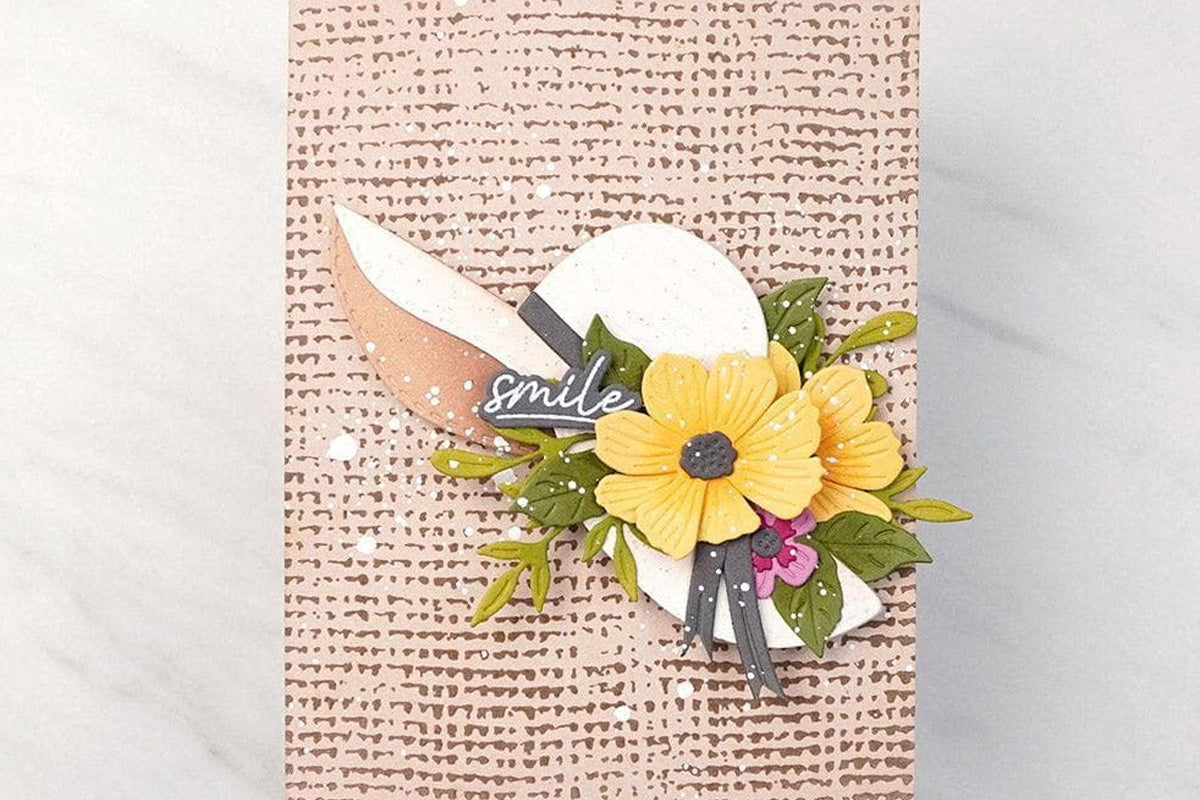 A boho style handmade greeting card with a floral hat and a rustic burlap background