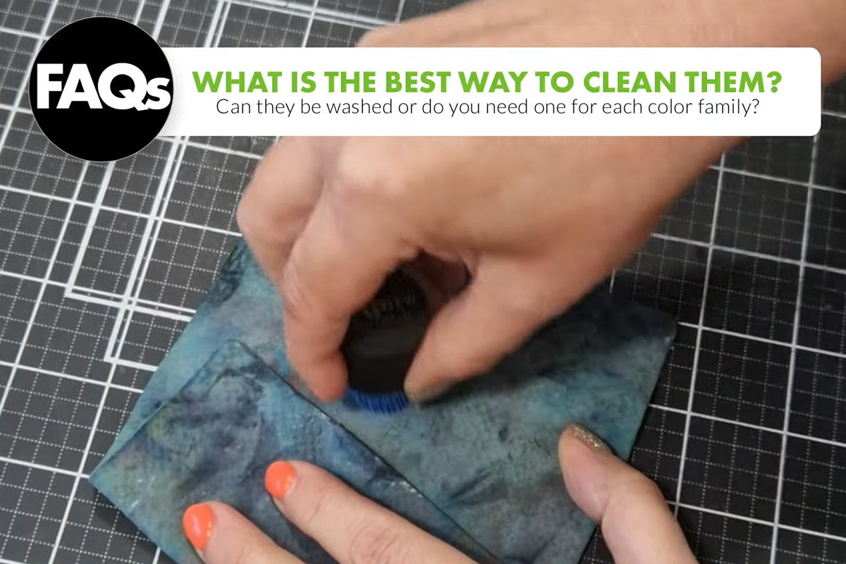 Cleaning a blending brush by wiping it down on a microfiber cloth