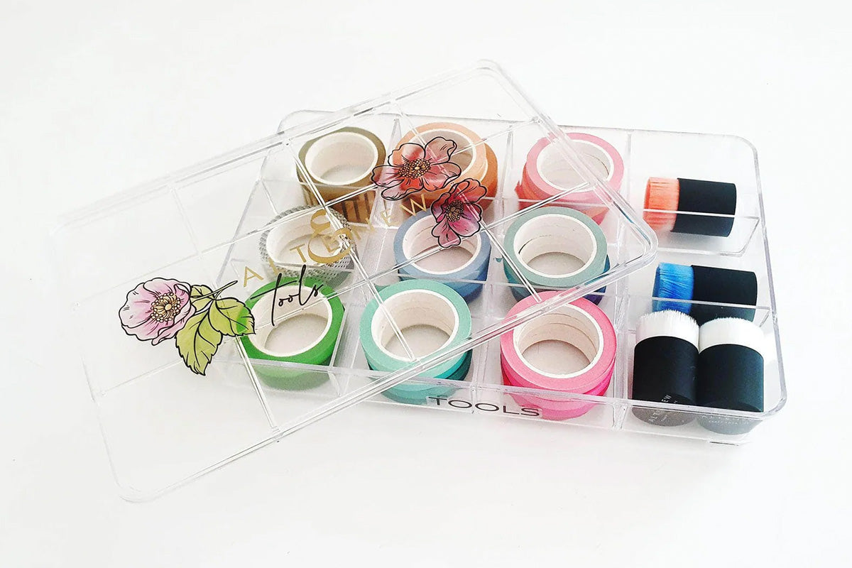 Crafting tools like washi tapes, masking tapes, and Small Blending Brushes inside Altenew's Crafter's Showcase container