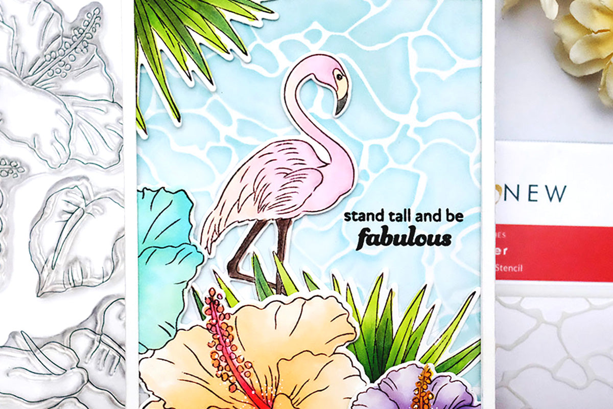 DIY encouragement card with a pink flamingo, tropical flowers, and a stenciled water background