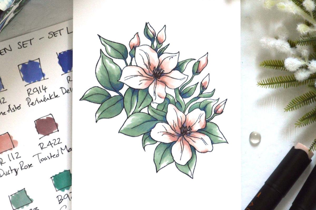 A card front with jasmine flowers stamped and colored in with Altenew alcohol markers