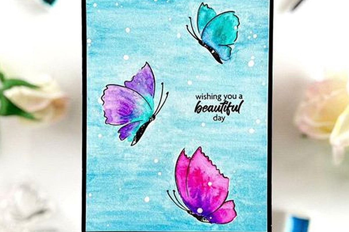 Painted butterflies on a handmade card, made with Altenew's new Stamp and Paint Set