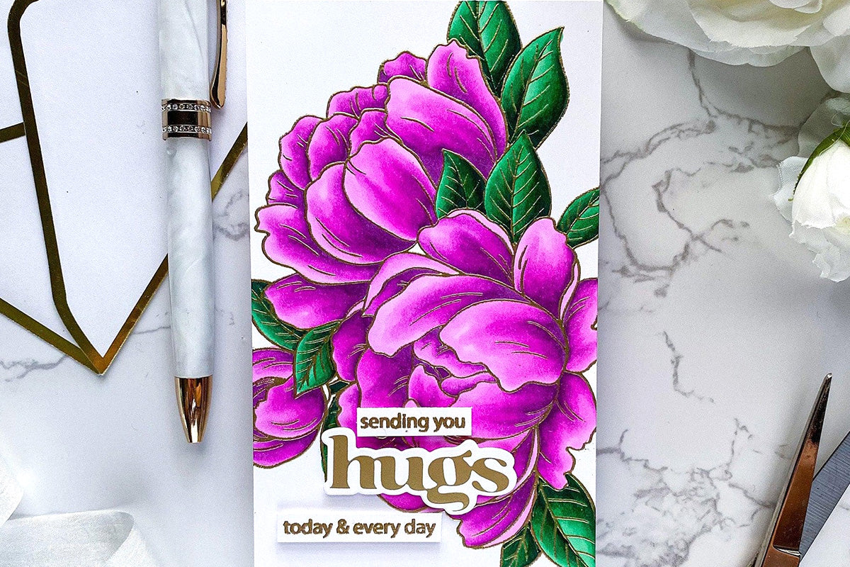 A hugs card with gorgeous purple purple blooms as the focal point
