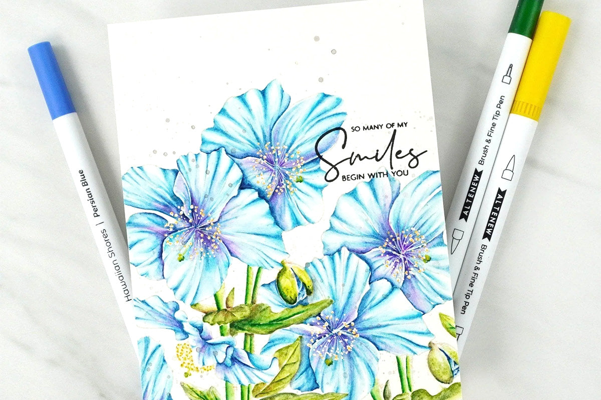 A card with blue blossoming flowers in the background colored in with Altenew's Hawaiian Shores Dual Tip Pens (Water-based)