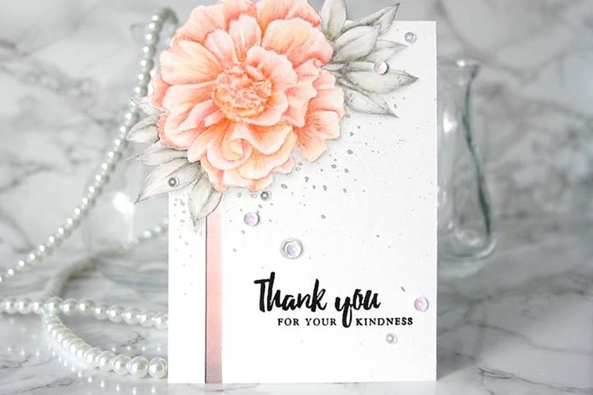 Beautiful and elegant thank you card with a peach camellia flower and some sequins