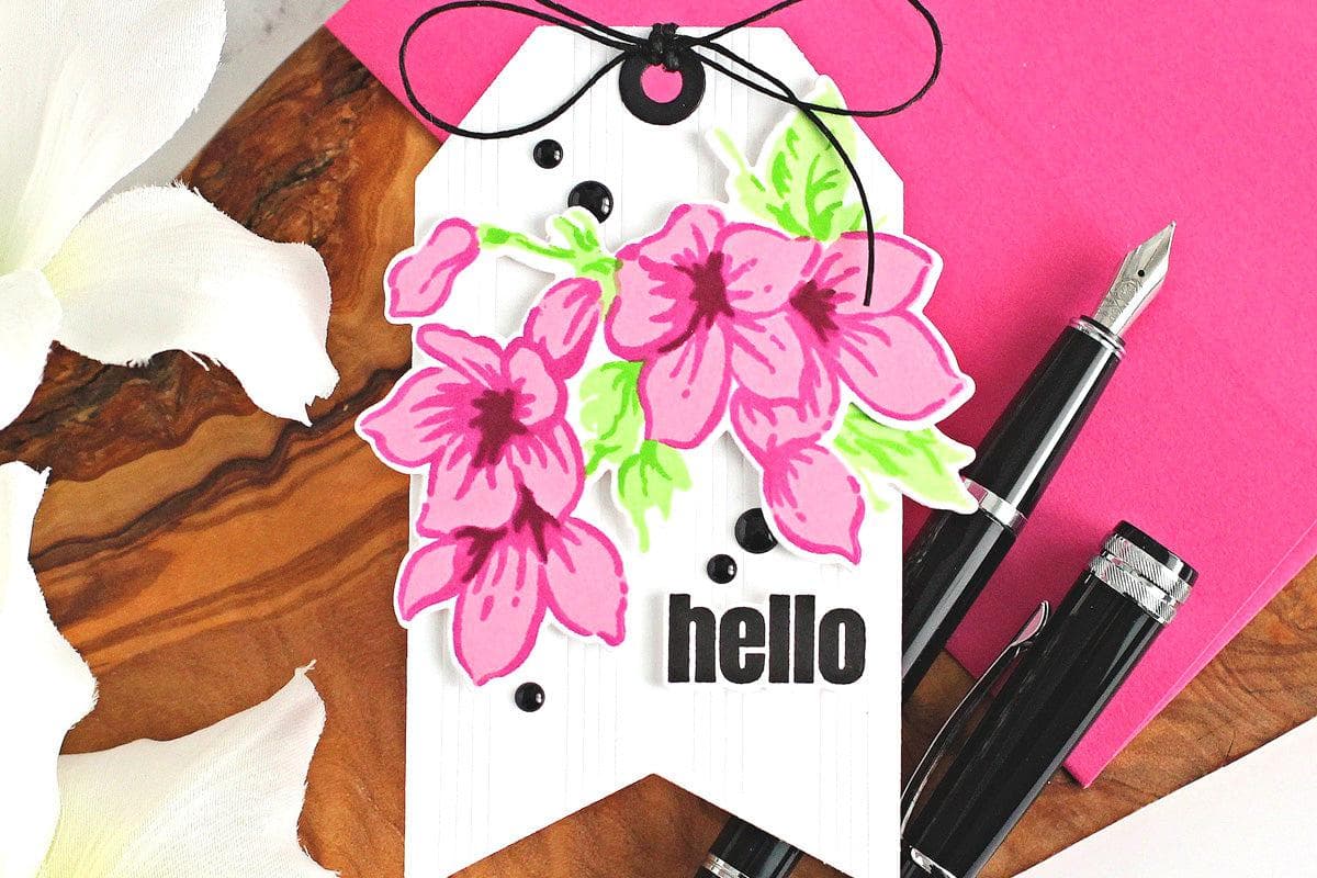 A tag featuring beautiful floral die-cuts 