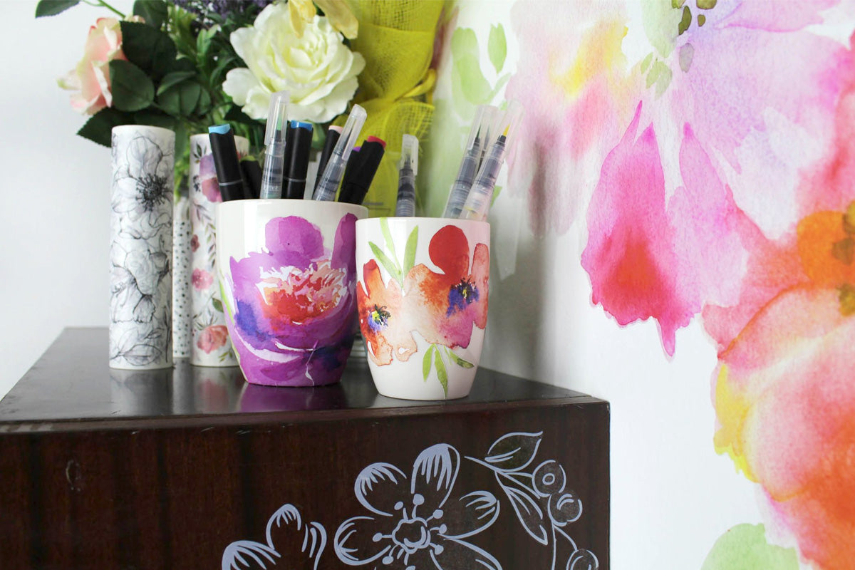 Decorate old mugs with flower decals and use them to store alcohol markers, brush pens, and other coloring mediums
