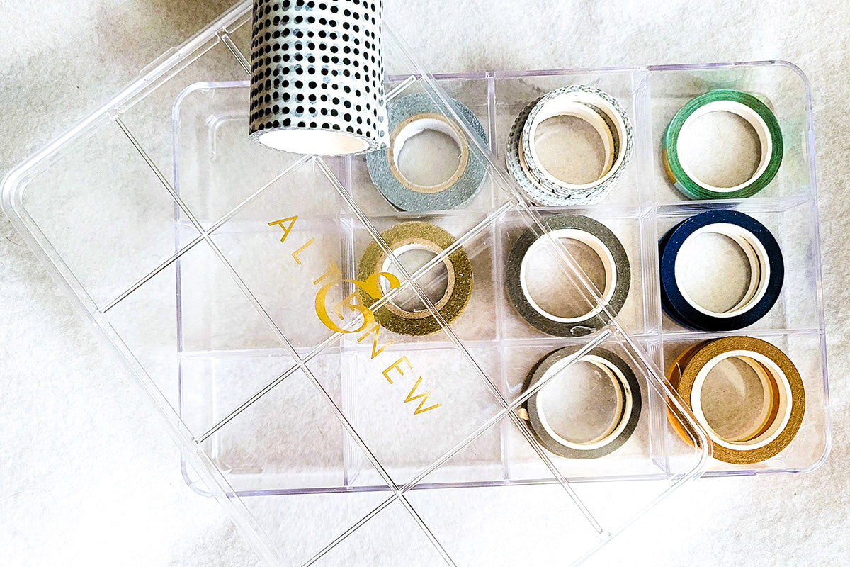 Clear stackable storage bins filled with Altenew washi tapes