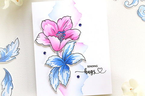 Beautiful clean and simple handmade card with a pink flower and the sentiment "sending hugs"