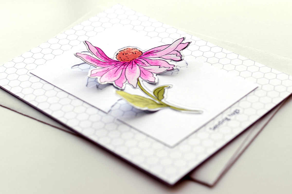 Clean and simple minimalist card idea with a honeycomb patterned paper background and a pink floral die-cut