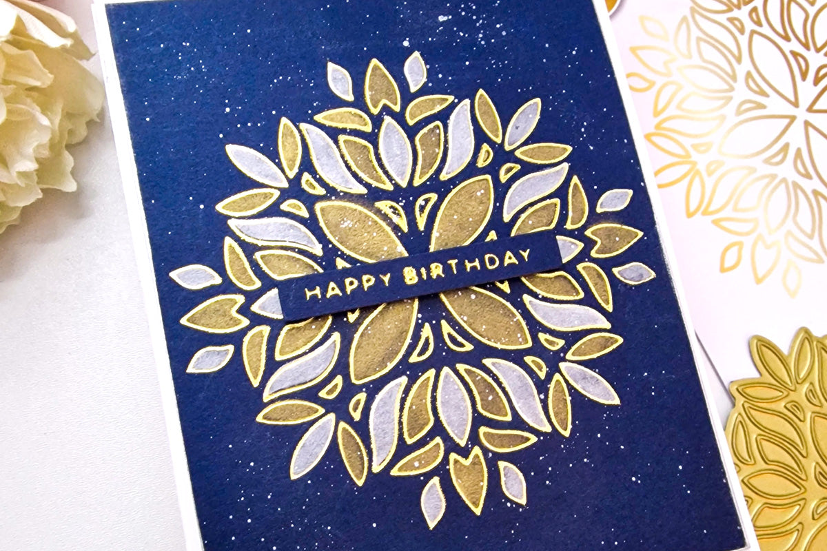 A navy blue background birthday card created with the Folk Mandala Hot Foil Plate from Altenew