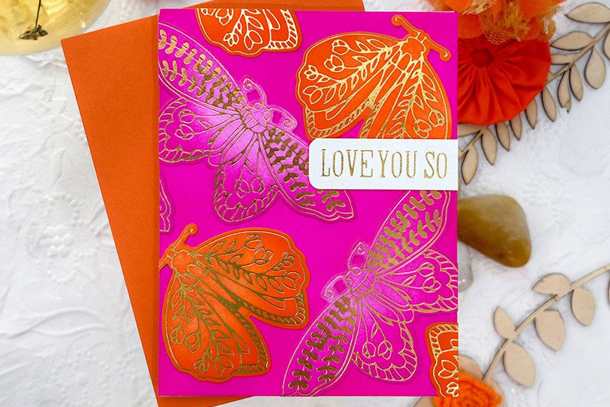 A "Love You So" card designed with intricate moths and hot foiling