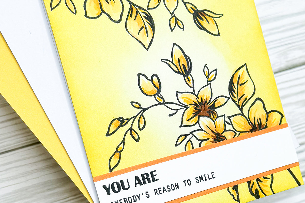 Monochromatic card with yellow flowers and foliage and the sentiment "you are somebody's reason to smile"