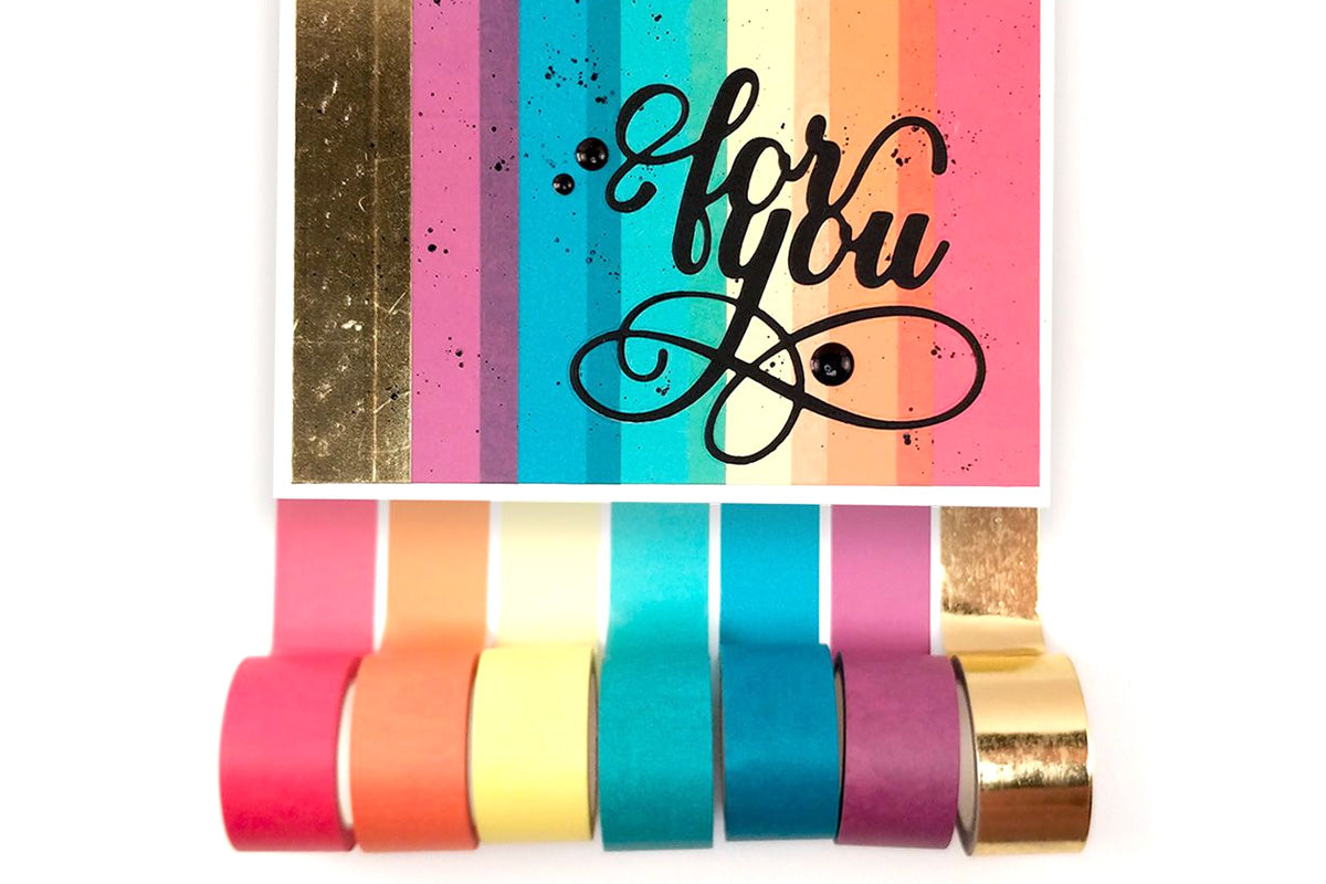 Rainbow gradient washi tapes covering the front of a simple handmade card