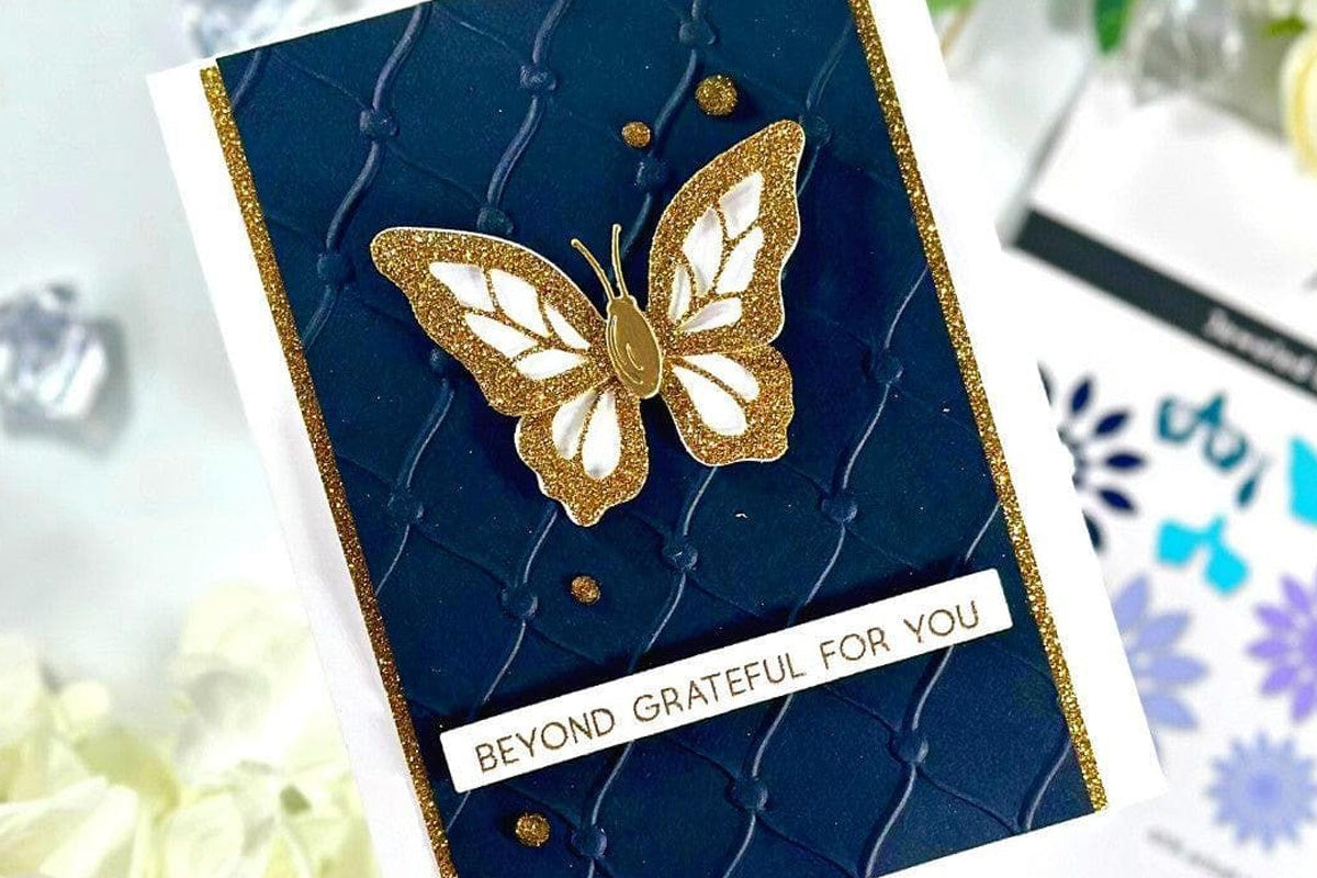 A card with a butterfly as a focal point created with a  sentiment using the One-Go Paper Crafting System