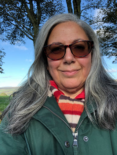 A profile picture of volunteer Ruth Muscat, taken in the coutryside around Glossop